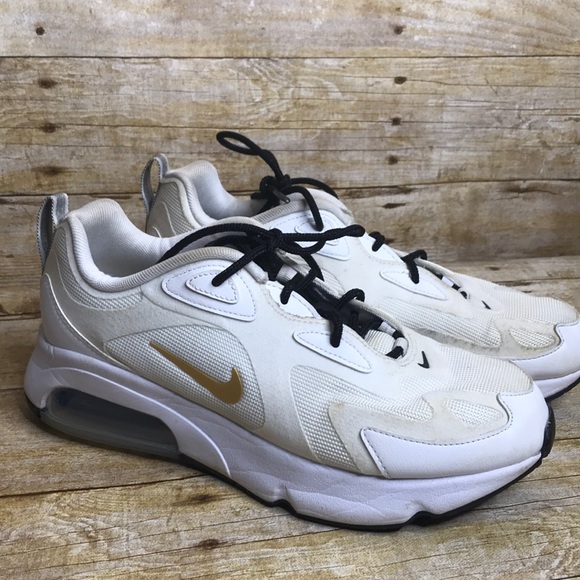 white nikes with gold swoosh